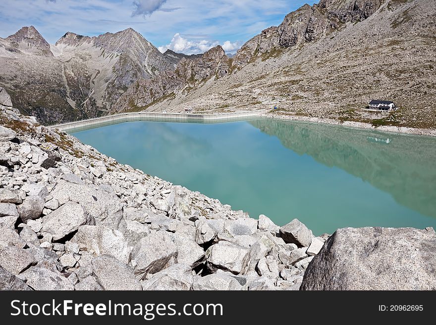 Dam and man-made lake between mountains. It’s Venerocolo Lake, North of Italy, Lombardy region, at 2.540 meters on the sea-level. Dam and man-made lake between mountains. It’s Venerocolo Lake, North of Italy, Lombardy region, at 2.540 meters on the sea-level