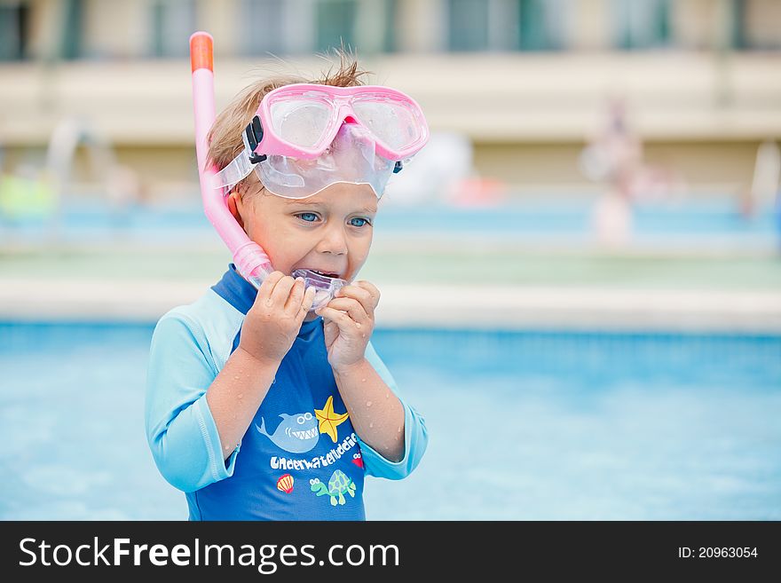 Boy playing in a pool of water