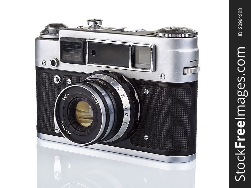 Old analog photo camera on a white background