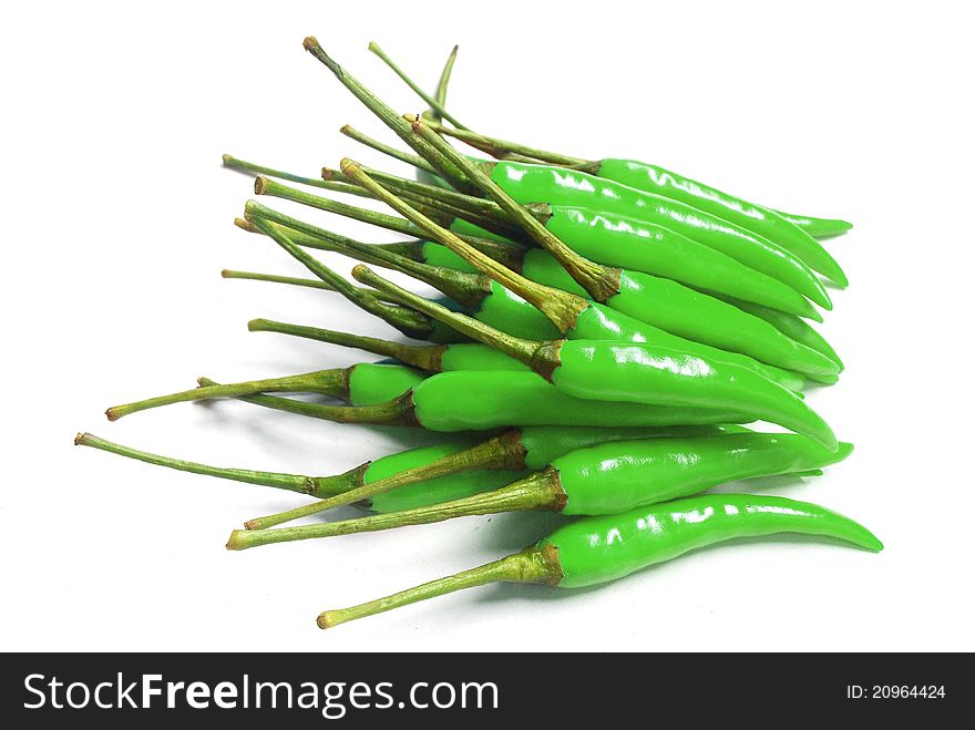 Many green chili for cooks on white background , it's spicy. Many green chili for cooks on white background , it's spicy