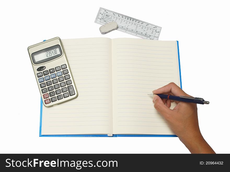 Hand writing on notebook with Calculator and ruler