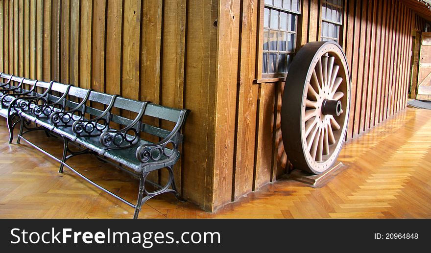 Historic home with old benches and wheel