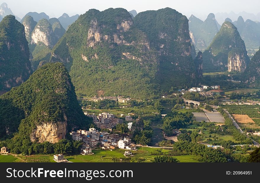 Aerial view image of Guilin village at sunset from Moon Hill mountain. Yangshuo, China, Asia