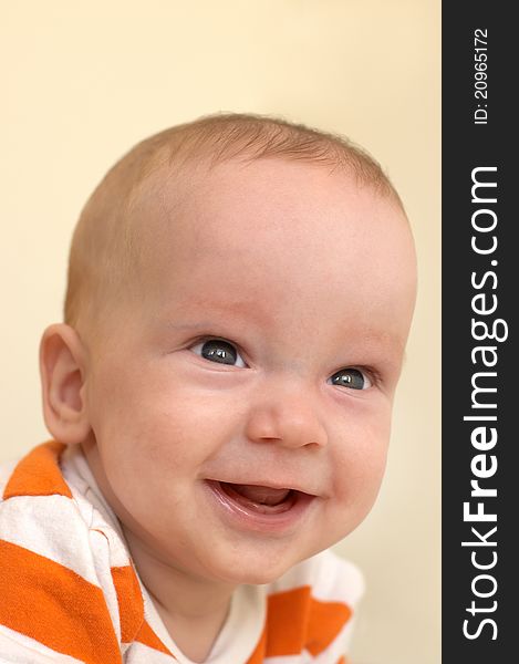 Portrait of cute baby boy in striped orange T-shirt. Portrait of cute baby boy in striped orange T-shirt