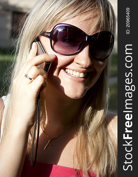 Young woman talking by mobile