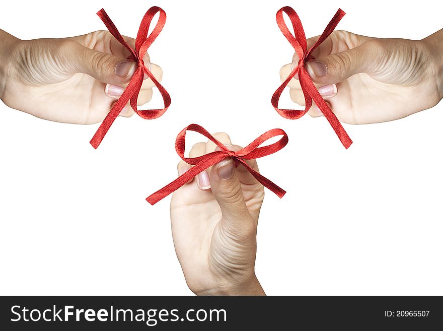 Red bow in hands isolated