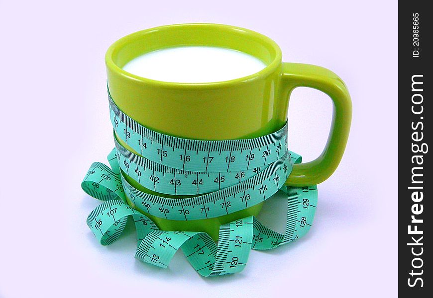 Cup of Kefir with a Tape Measuring on a White Background as Concept of Kefir Diet