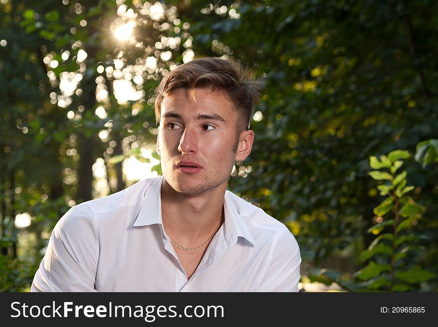 Portrait of male model in the park at sunrise. Portrait of male model in the park at sunrise