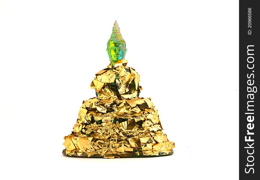 Green budha statue covered with gold paper isolated on white. Green budha statue covered with gold paper isolated on white