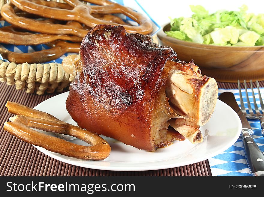 Grilled pork hock on a white background