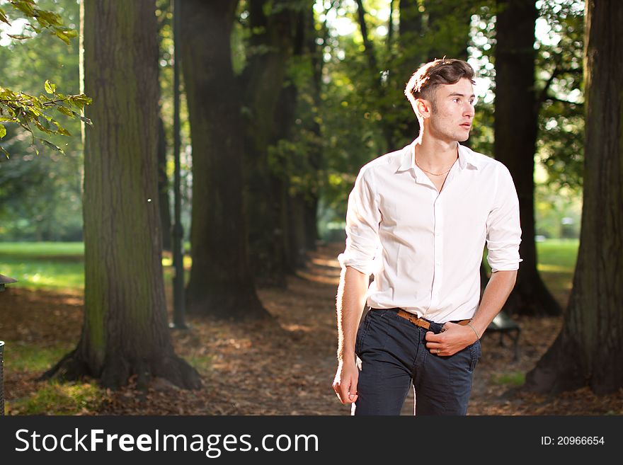 Handsome young model in the park at sunrise. Handsome young model in the park at sunrise