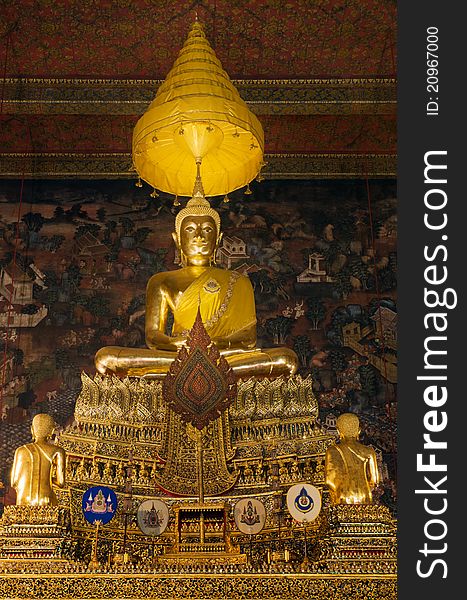 The principal Buddha image is â€œPhra Buddha Deva Patimakornâ€ in a gesture of seated Buddha on a three tiered pedestal