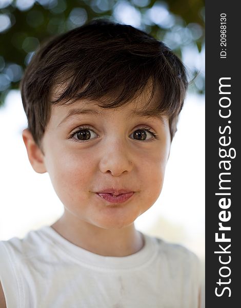 Child close up portrait doing faces outdoor. Child close up portrait doing faces outdoor
