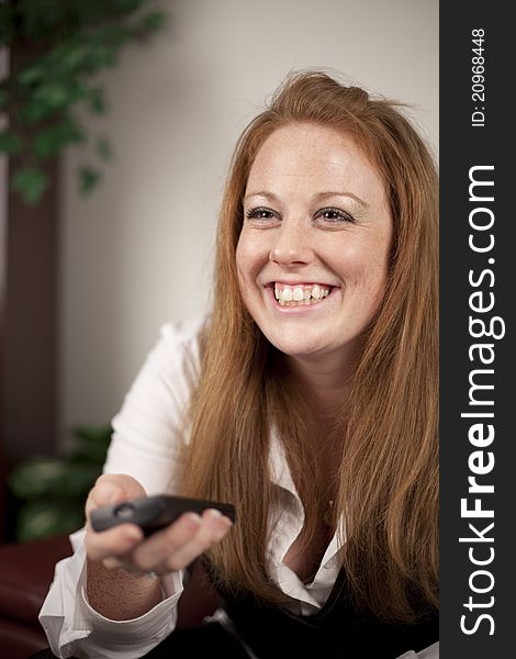 Girl portrait watching tv and smiling