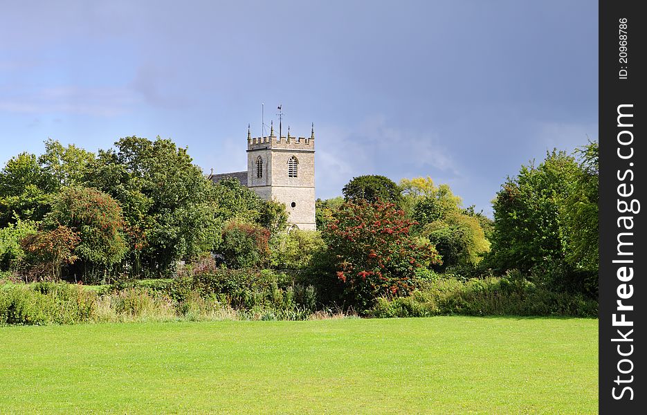 An English Rural Landscape with Village Church Tower between the trees