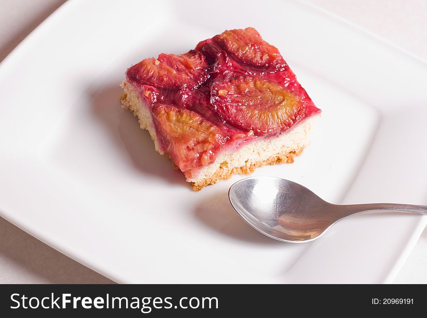 Plum cake on a plate. Plum cake on a plate.