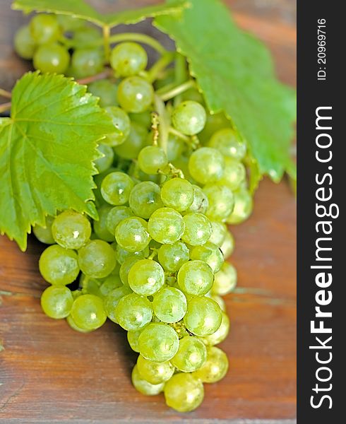 Grapes on a wooden table.
