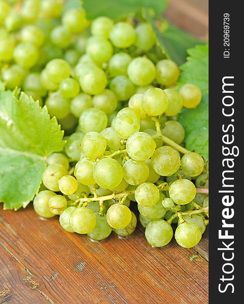 Grapes fruits composition on wooden table