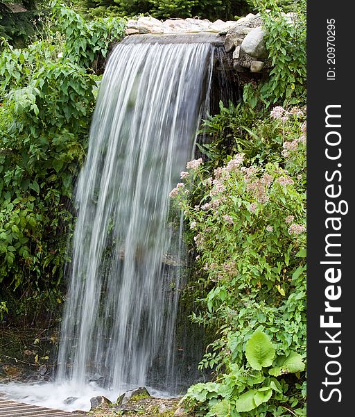 Beautiful waterfall between green vegetation