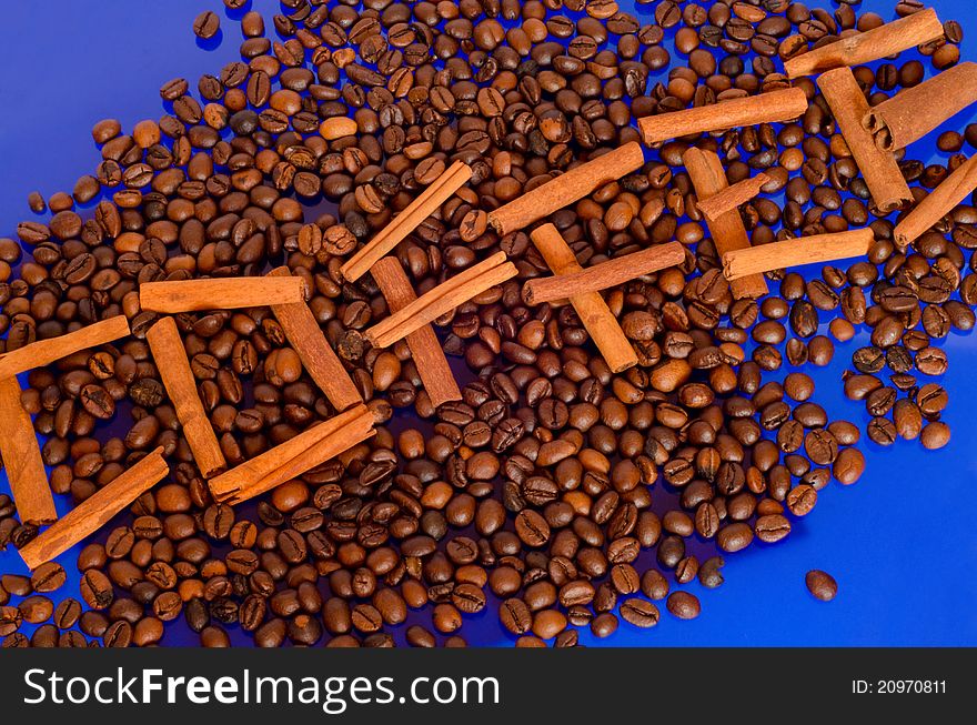 Coffee beans on blue background.
