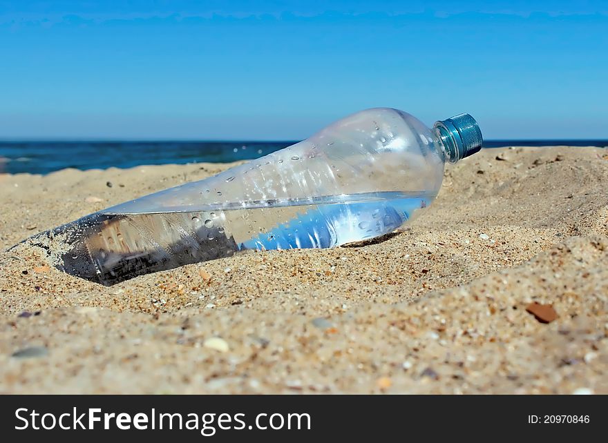 Bottle of the water on the beach of the sea. Bottle of the water on the beach of the sea