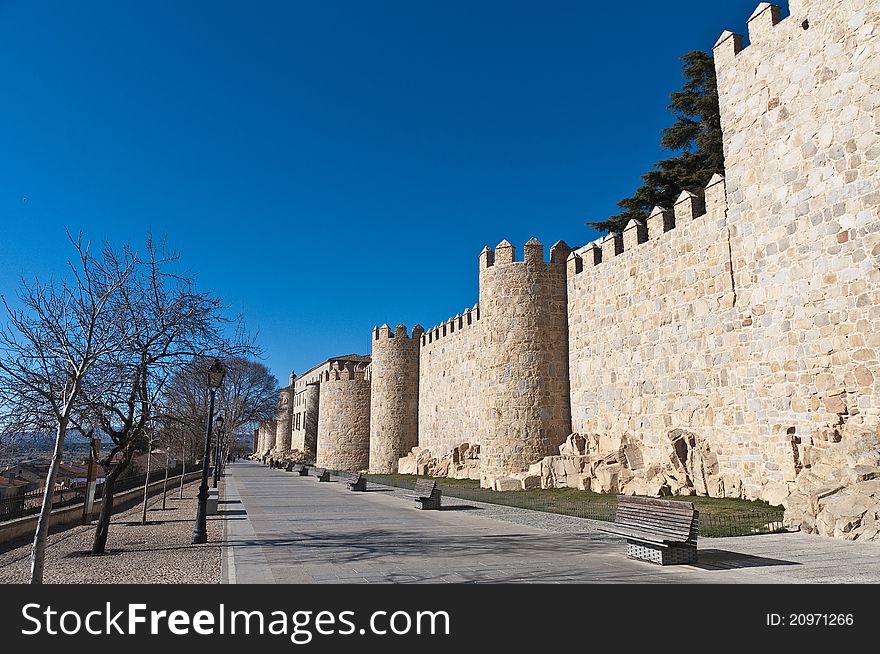 Defensive walls tower around Avila, Spain