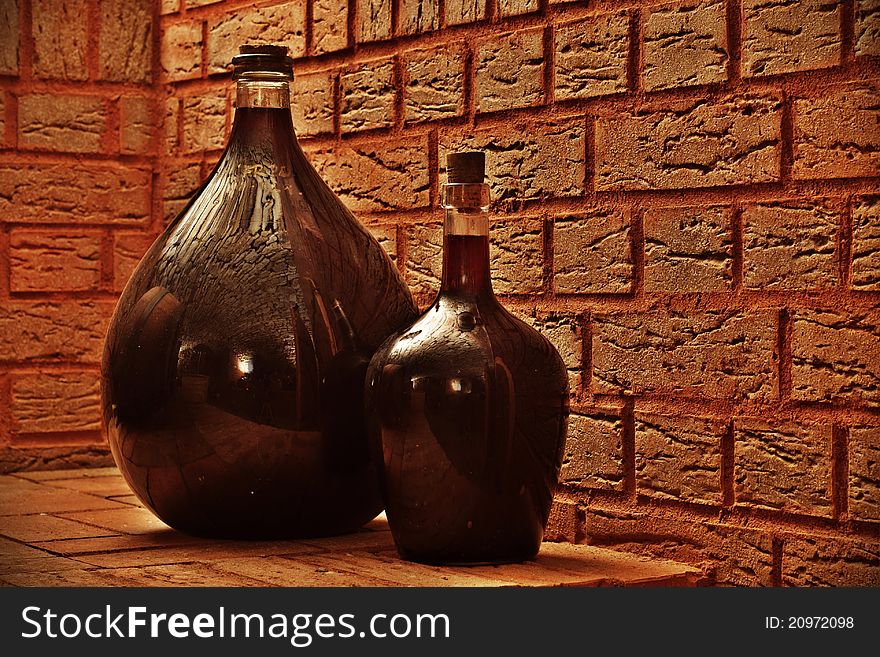 Demijohns with red wine in wine celler. Demijohns with red wine in wine celler