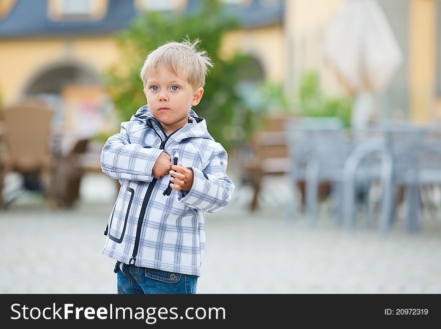 Cute little boy outdoors in city street. Cute little boy outdoors in city street