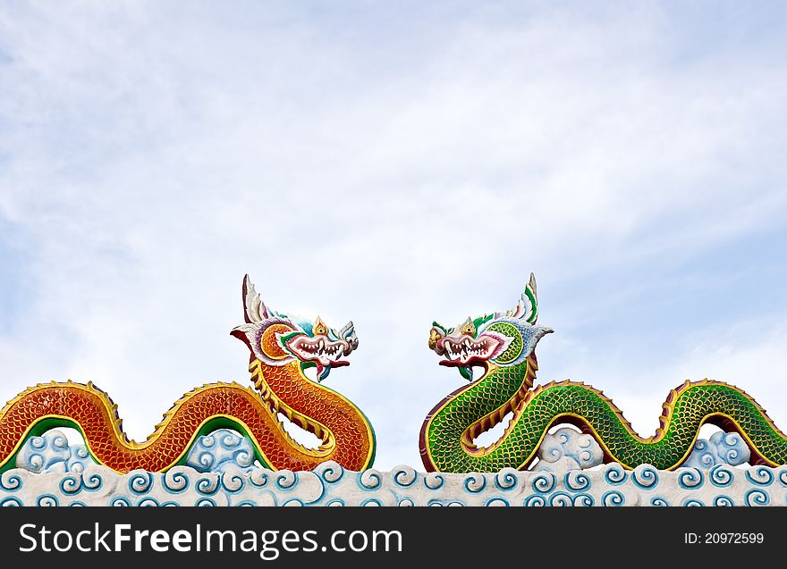 Two thai dragon statue with cloud in the sky, Thailand