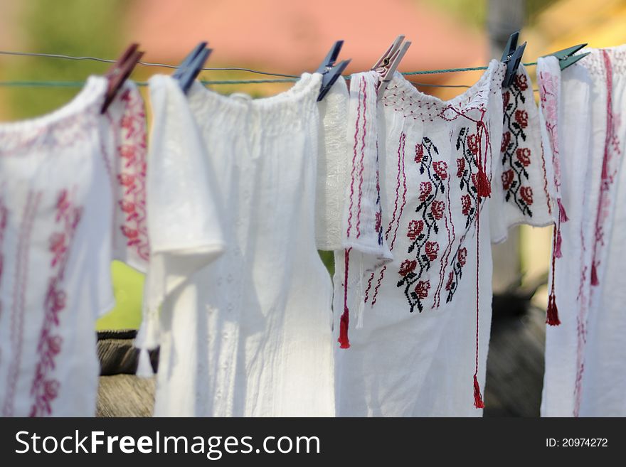 Traditional shirt from Romania hanging outside for sale. Traditional shirt from Romania hanging outside for sale