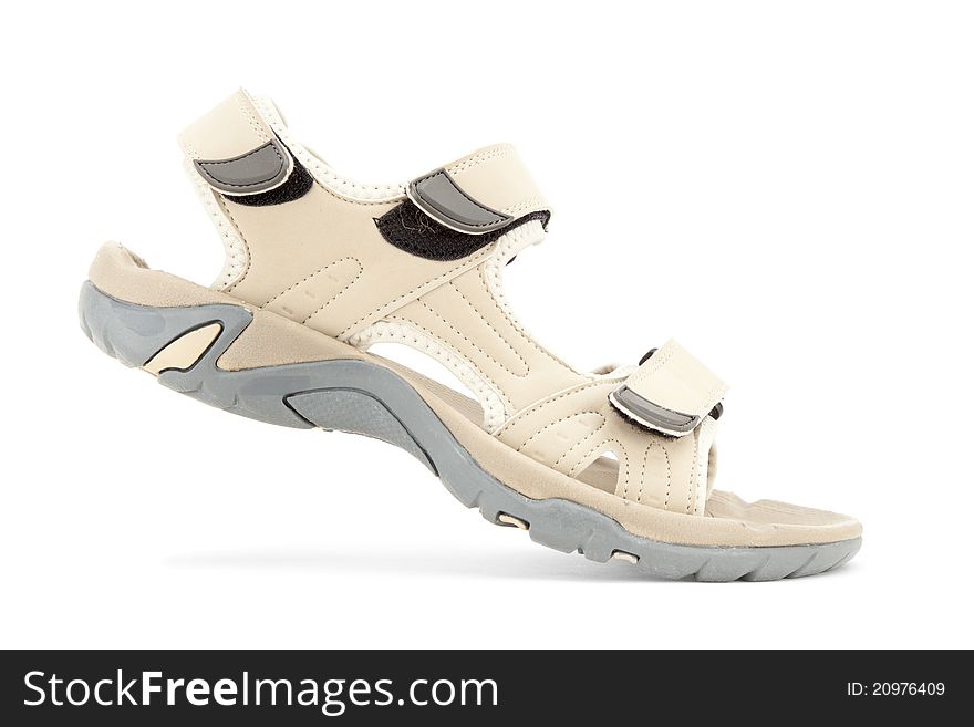 Side view of female travel sandal over white background