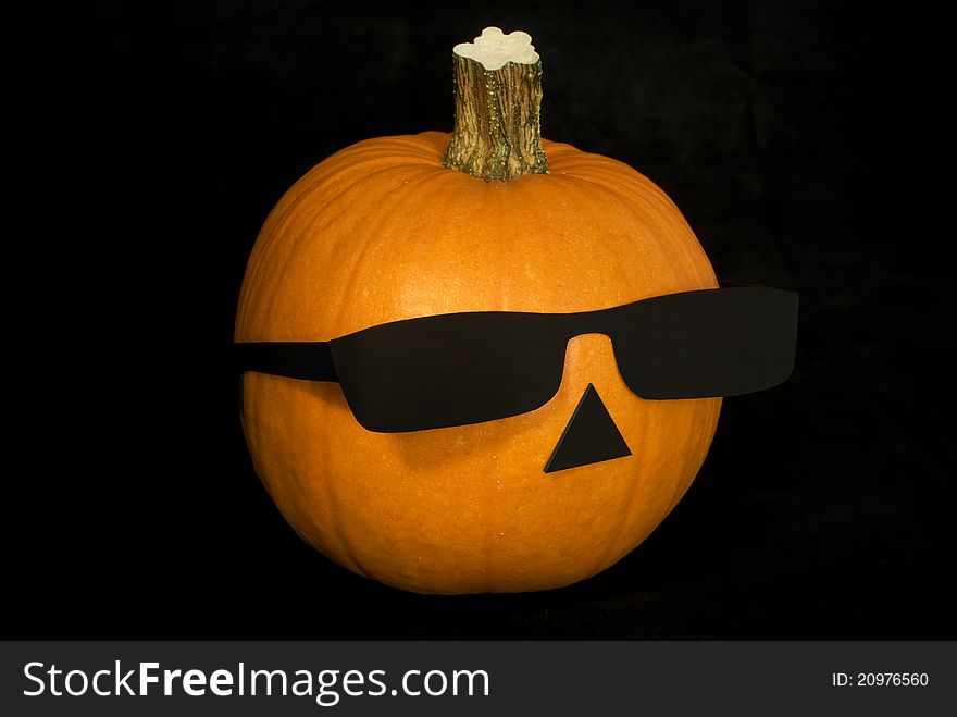 Alternative Halloween Pumpkin with black sunglasses (you can paint a terrible smile or happy)