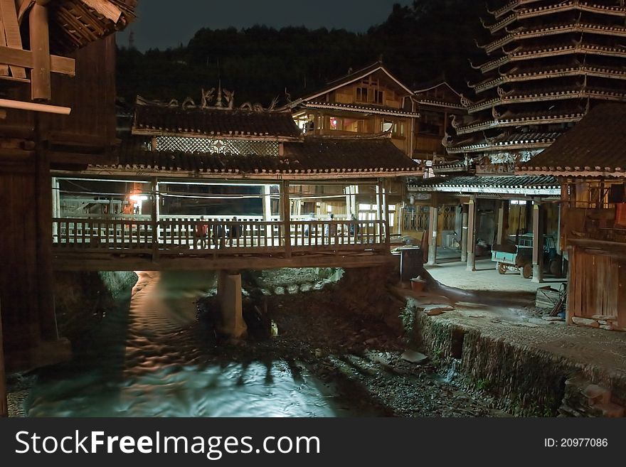 Zhaoxing Chinese Village old architecture at night near the river. Zhaoxing Chinese Village old architecture at night near the river