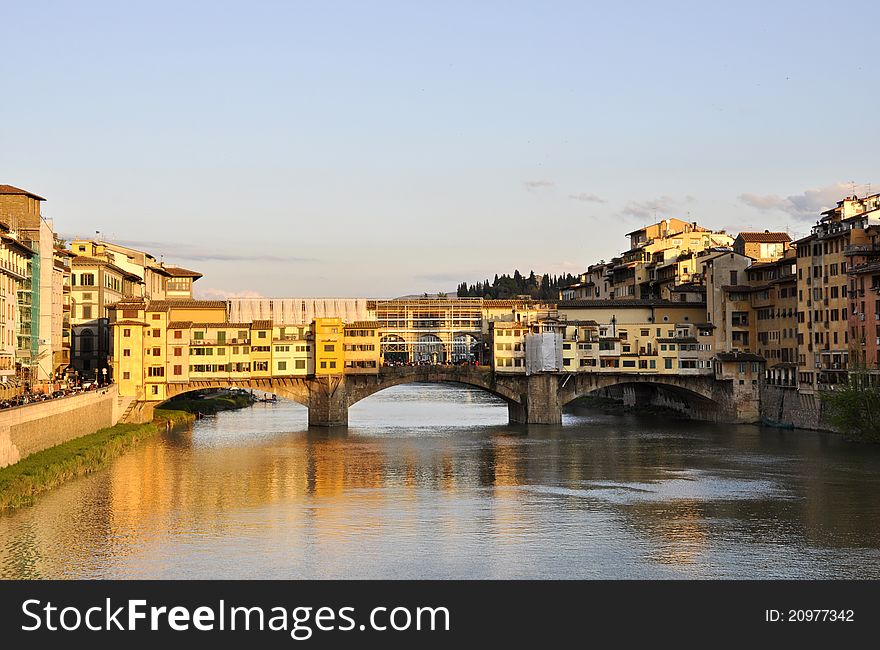 The Ponte Vecchio and the Arno river at sunset. The Ponte Vecchio and the Arno river at sunset