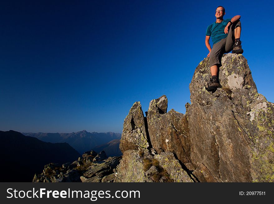 Young man enjoying sunrise in the mountains. Young man enjoying sunrise in the mountains