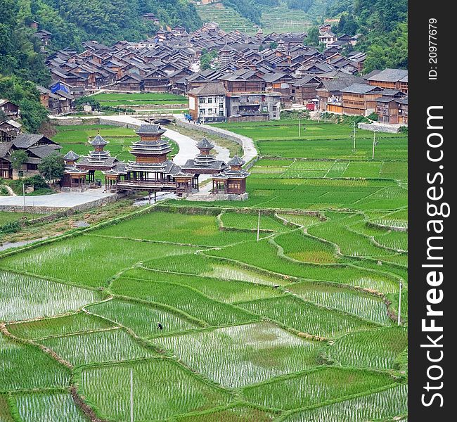 Colour image of Chinese Village on the rice terrace at sunset. View at mountain and rice terrace near the river. Colour image of Chinese Village on the rice terrace at sunset. View at mountain and rice terrace near the river.