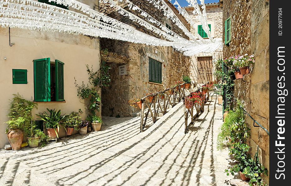 Mountain village architecture decorated with fiesta stripes and flowers