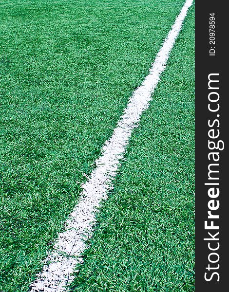 Fake grass soccer field with white line