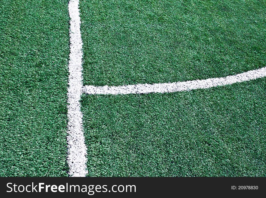 Fake grass soccer field with white line