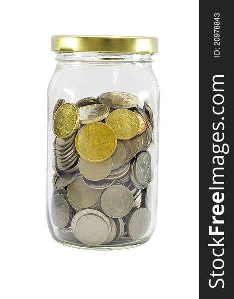 Saving money concept with coins put in the glass.