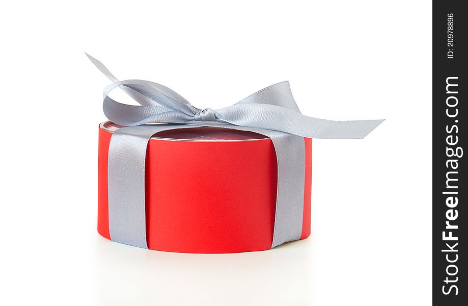 Red gift box with ribbon on a white background. Red gift box with ribbon on a white background