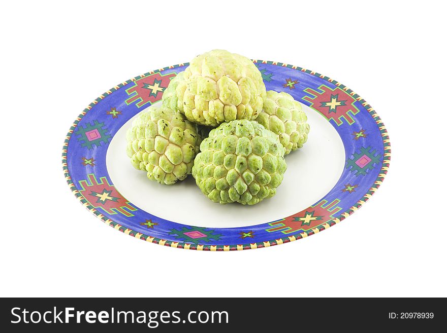 Custard apples group and opened one on a plate with isolate wihite background.
