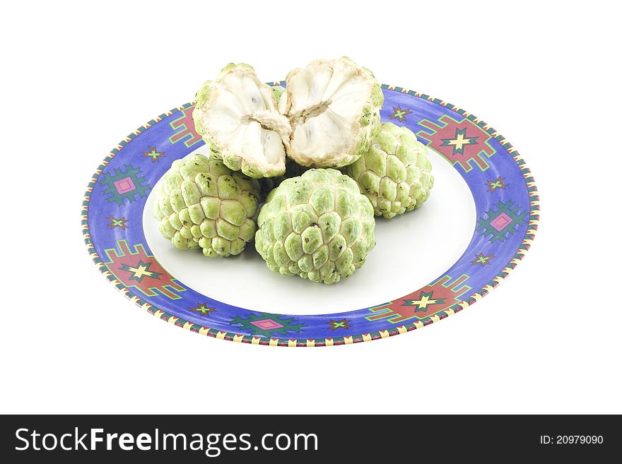 Custard apples group and opened one on white background with isolate. Custard apples group and opened one on white background with isolate.