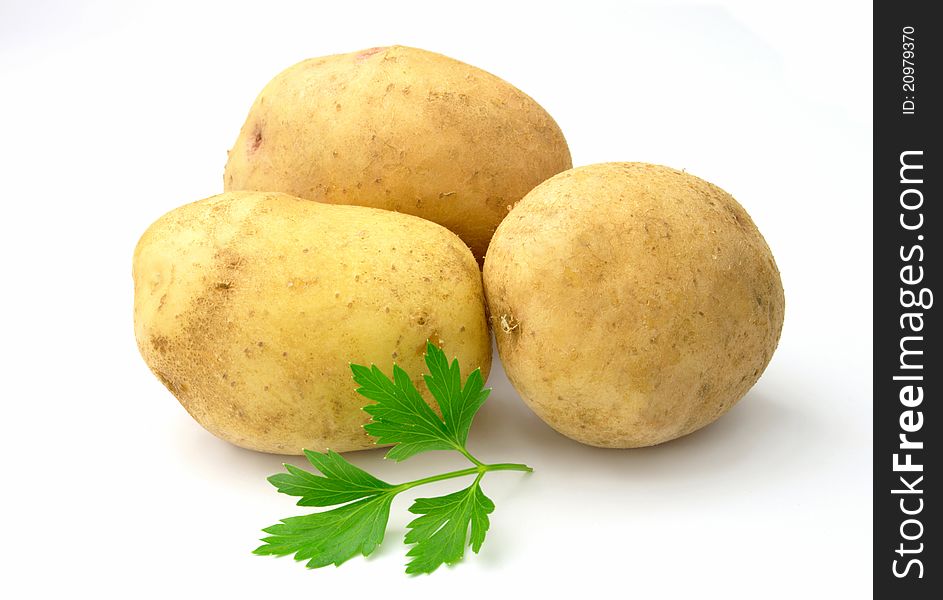 Tubers of potatoes on a white background. Tubers of potatoes on a white background