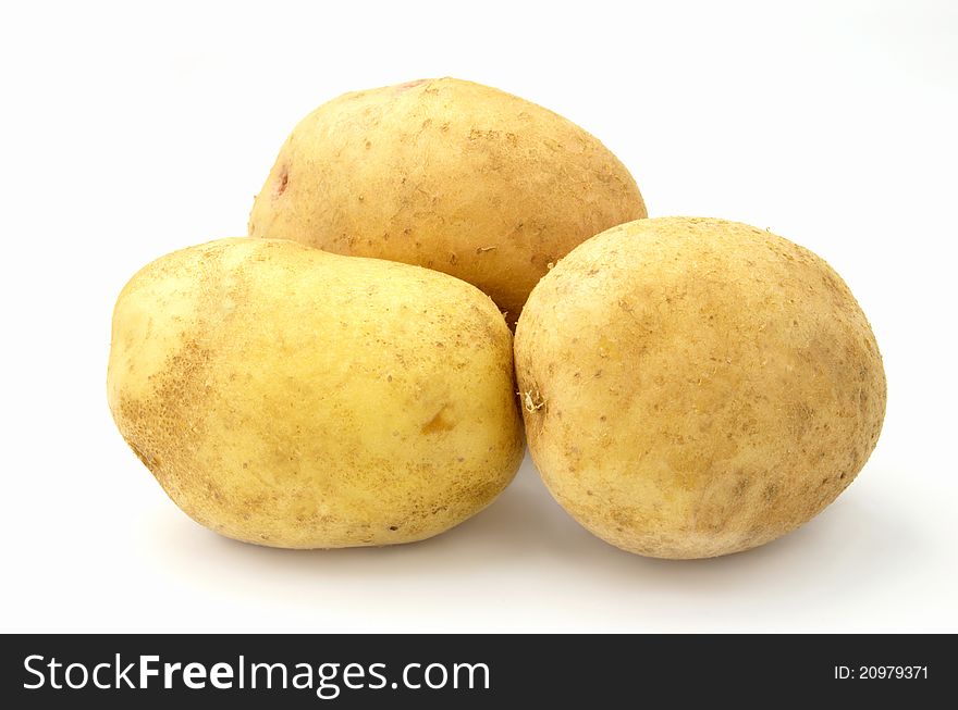 Tubers of potatoes on a white background. Tubers of potatoes on a white background