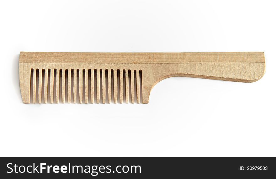 Wooden comb on a white background