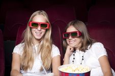Two Beautiful Girls Watching A Movie At The Cinema Stock Photography Two Beautiful Girls Watching A Movie At The Cinema Stock Photography