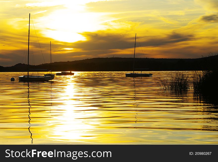 Sailboats At Sunset