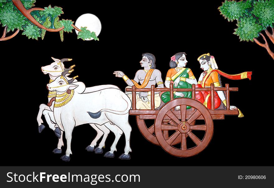 Traditional bullock cart carrying bride with her parent for wedding.