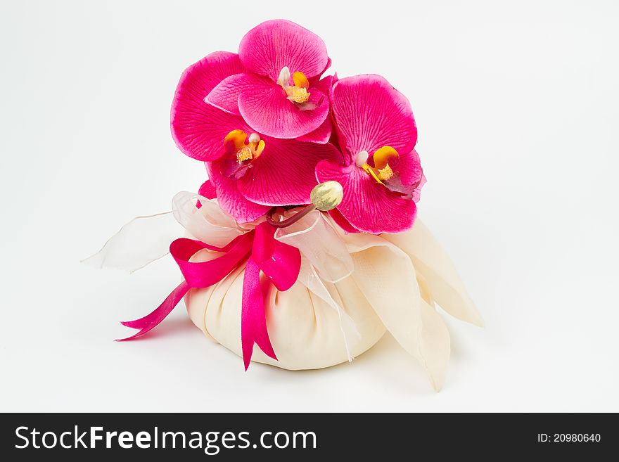 Decorative orchid in a fabric bag